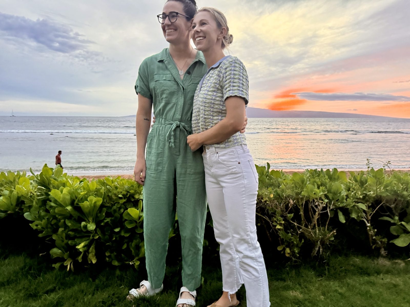 Amy and Megan embracing at sunset in Maui, Hawaii